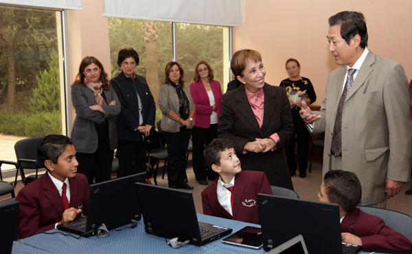 HRH Princess Basma and Chinese Ambassador to Jordan Gao Yusheng speak to students at Mabarrat Um Al Hussein on Saturday (Petra photo)